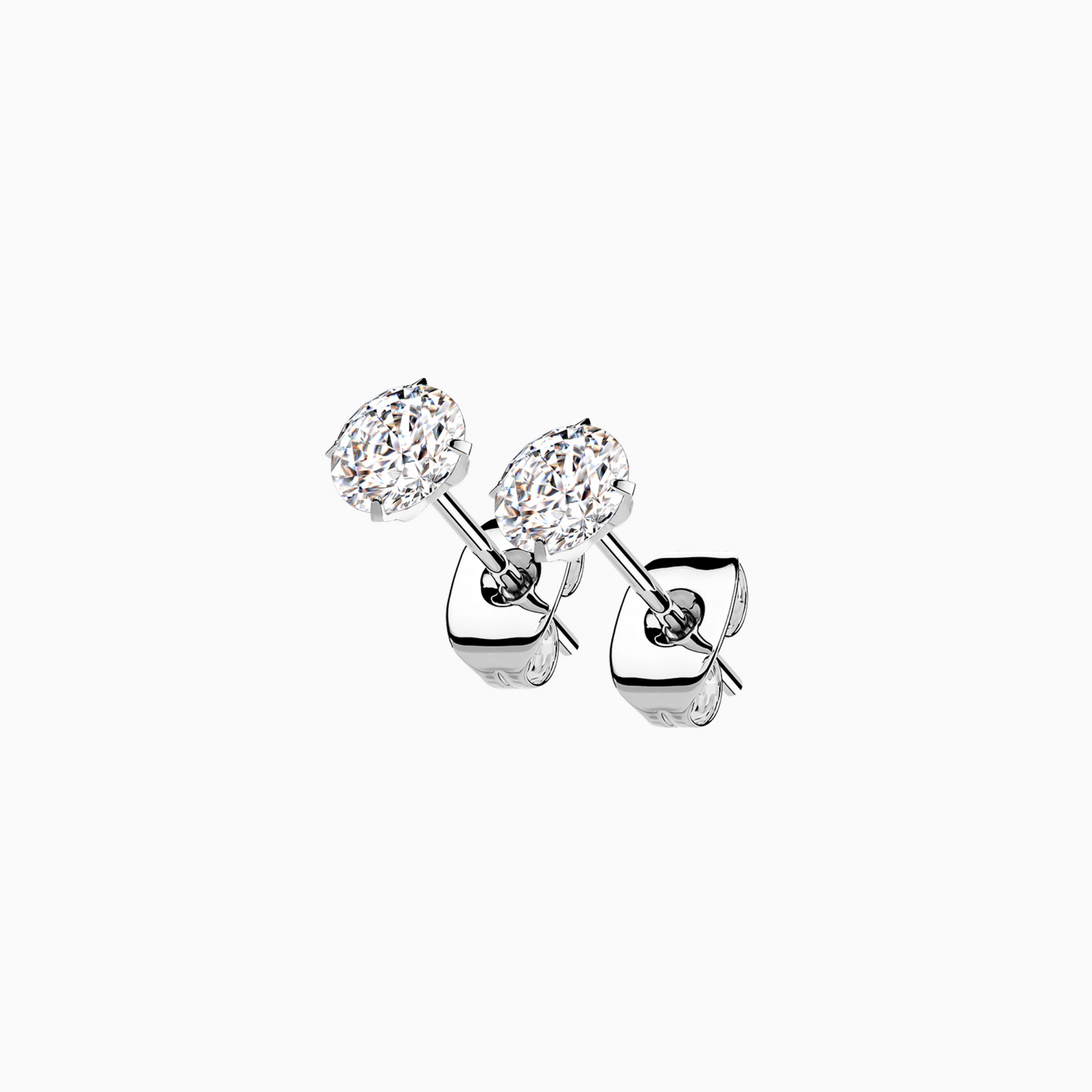 Close-up image of a pair of round-cut cubic zirconia stud earrings with butterfly backs, made of implant grade titanium